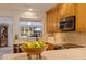 Kitchen counter with a wooden bowl of green apples at 165 4Th N Ave, Tierra Verde, FL 33715