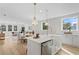 Modern kitchen with white cabinets, farmhouse sink, and stainless steel appliances at 208 W Frances Ave # 2, Tampa, FL 33602