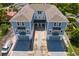 Aerial view of a two-unit duplex with individual garages and a shared walkway at 208 W Frances Ave # 3, Tampa, FL 33602