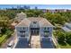 Aerial view of two-unit duplex with attached garages, paved driveways, and walkway at 208 W Frances Ave # 3, Tampa, FL 33602