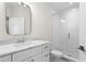Modern bathroom with a frameless shower and marble vanity at 208 W Frances Ave # 3, Tampa, FL 33602