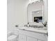 Bathroom with white vanity, marble countertop, and a large mirror at 208 W Frances Ave # 3, Tampa, FL 33602