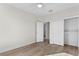 Bedroom with hardwood floors, ceiling fan, and closet at 208 W Frances Ave # 3, Tampa, FL 33602
