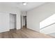 Bedroom with hardwood floors, closet, and access to a hallway at 208 W Frances Ave # 3, Tampa, FL 33602