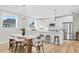 Bright kitchen featuring white cabinets, an island, and stainless steel appliances at 208 W Frances Ave # 3, Tampa, FL 33602