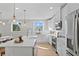 Modern kitchen with white cabinets, island, and stainless steel appliances at 208 W Frances Ave # 3, Tampa, FL 33602