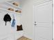Laundry area with white shaker cabinets, marble countertop, and built-in bench at 208 W Frances Ave # 3, Tampa, FL 33602