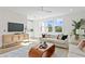 Open living space with comfortable seating and a large TV at 208 W Frances Ave # 3, Tampa, FL 33602