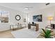 Bright office space with hardwood floors, large artwork, and comfortable seating at 208 W Frances Ave # 3, Tampa, FL 33602