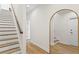 Modern staircase with white risers and wooden treads, light walls, and hardwood floors at 208 W Frances Ave # 3, Tampa, FL 33602
