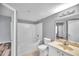 Bathroom with white bathtub, toilet, and vanity with sink at 10764 70Th Ave # 2208, Seminole, FL 33772