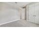 Spacious bedroom with gray carpet and double door closet at 2424 Wise River Ln, Zephyrhills, FL 33544