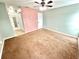 Bedroom features a ceiling fan and neutral-colored walls and flooring, ready for personalization at 2288 Citrus Ct, Clearwater, FL 33763