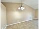 Neutral dining room featuring tile floors and modern chandelier-style lighting at 2288 Citrus Ct, Clearwater, FL 33763