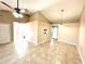 Bright living room featuring tile floors, a ceiling fan, and neutral paint colors at 2288 Citrus Ct, Clearwater, FL 33763