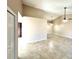 Spacious living room with tile floors, a fan, and modern lighting at 2288 Citrus Ct, Clearwater, FL 33763