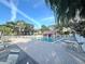 Take a dip in the community pool surrounded by a brick patio, palm trees, and lounge chairs at 2288 Citrus Ct, Clearwater, FL 33763