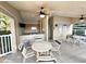 Outdoor poolside kitchen and dining area provides a relaxing space to enjoy the community's amenities at 2288 Citrus Ct, Clearwater, FL 33763