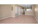 Light-filled dining room with tile floors and access to kitchen at 4517 Kennewick Pl, Riverview, FL 33578