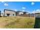 Spacious backyard with grassy area and privacy fence at 9917 Spanish Lime Ct, Riverview, FL 33578