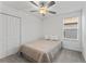 Bright bedroom with double bed and closet, featuring neutral tones at 9917 Spanish Lime Ct, Riverview, FL 33578