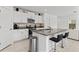 Kitchen with granite countertop and white cabinets at 9917 Spanish Lime Ct, Riverview, FL 33578