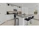 Modern kitchen with white cabinets and granite countertops at 9917 Spanish Lime Ct, Riverview, FL 33578