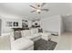 Open living room featuring a sectional sofa, pool table, and kitchen island at 9917 Spanish Lime Ct, Riverview, FL 33578