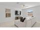 Living room featuring a sectional sofa and large TV at 9917 Spanish Lime Ct, Riverview, FL 33578