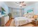 Calming bedroom with light blue walls, a plush bed, neutral accents, and bright natural light at 1020 85Th N Ave # 223, St Petersburg, FL 33702