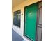 Exterior of condo with green door and number 223 at 1020 85Th N Ave # 223, St Petersburg, FL 33702