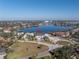 An aerial view showcases the spacious property with its manicured lawn and stunning waterfront location at 105 Cordova Ne Blvd, St Petersburg, FL 33704