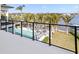 Balcony view of the pool and lush tropical landscaping with waterfront views at 105 Cordova Ne Blvd, St Petersburg, FL 33704