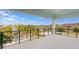 Expansive balcony featuring waterfront views, black railings, white floors, and ample space for outdoor seating at 105 Cordova Ne Blvd, St Petersburg, FL 33704
