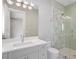 Bright bathroom with a marble shower, large mirror, and modern vanity at 105 Cordova Ne Blvd, St Petersburg, FL 33704