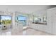 Beautiful bathroom featuring a soaking tub, glass enclosed shower, double vanities, and views of the water at 105 Cordova Ne Blvd, St Petersburg, FL 33704