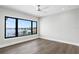 Empty bedroom features hardwood floors and a view of the water at 105 Cordova Ne Blvd, St Petersburg, FL 33704