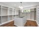 Spacious walk-in closet with ample storage and chandelier lighting at 105 Cordova Ne Blvd, St Petersburg, FL 33704