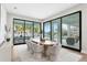 Dining area with water view features large windows and modern furniture at 105 Cordova Ne Blvd, St Petersburg, FL 33704