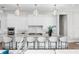 Elegant kitchen features white cabinetry, marble countertops, and modern pendant lighting at 105 Cordova Ne Blvd, St Petersburg, FL 33704