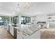 Open-concept kitchen with an oversized island, modern appliances, and seamless access to the living area at 105 Cordova Ne Blvd, St Petersburg, FL 33704