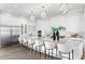 Spacious kitchen boasts stainless steel appliances, white cabinetry, and a large marble island at 105 Cordova Ne Blvd, St Petersburg, FL 33704