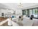 Open-concept living room offering stylish furniture, wood floors, recessed lighting, and a picturesque view at 105 Cordova Ne Blvd, St Petersburg, FL 33704