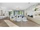 Bright living room featuring modern decor, recessed lighting, wood flooring, a fireplace, and a sliding glass door at 105 Cordova Ne Blvd, St Petersburg, FL 33704