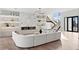 Bright living room featuring modern decor, recessed lighting, wood flooring, a fireplace, and an open staircase at 105 Cordova Ne Blvd, St Petersburg, FL 33704