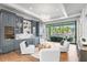 Elegant living room with a water view, stylish furnishings, and adjacent bar area at 105 Cordova Ne Blvd, St Petersburg, FL 33704