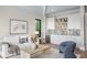 Comfortable living room with wet bar, white sofa, and stylish decor at 105 Cordova Ne Blvd, St Petersburg, FL 33704
