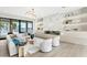 Elegant living room featuring modern decor, recessed lighting, wood flooring, a fireplace, and a sliding glass door at 105 Cordova Ne Blvd, St Petersburg, FL 33704