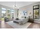 Spacious main bedroom with large windows, accent lighting, and a sitting area, creating a relaxing retreat at 105 Cordova Ne Blvd, St Petersburg, FL 33704