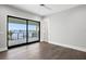 Spacious main bedroom with a ceiling fan and large glass doors leading to a balcony with water views at 105 Cordova Ne Blvd, St Petersburg, FL 33704